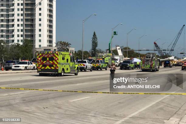 This image shows a newly installed pedestrian bridge over a six-lane highway in Miami on a college campus that collapsed on March 15 crushing a...