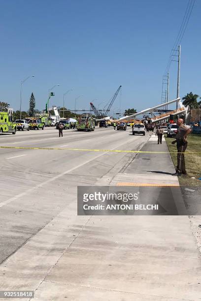 This image shows a newly installed pedestrian bridge over a six-lane highway in Miami on a college campus that collapsed on March 15 crushing a...