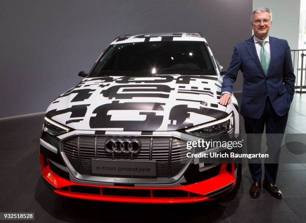 Annual Press Conference of AUDI AG in Ingolstadt. Rupert Stadler, CEO of Audi AG, stands at a e-tron prototype.