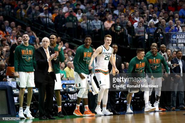 The Miami Hurricanes bench cheers in the second half while taking on the Loyola Ramblers in the first round of the 2018 NCAA Men's Basketball...