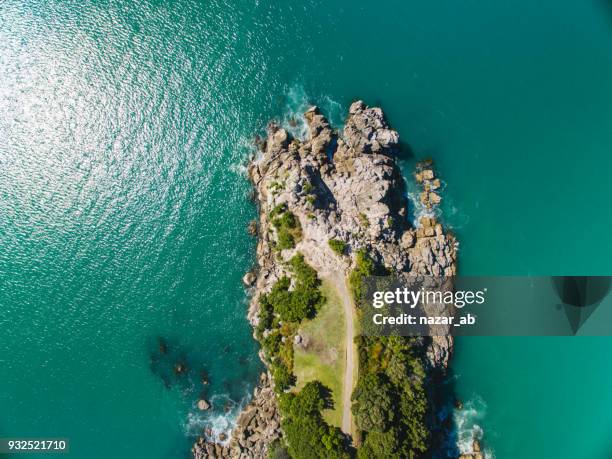 top looking down at moturiki island, new zealand. - mount maunganui stock pictures, royalty-free photos & images