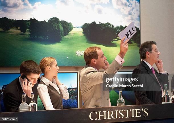 Auctioners dealing with international phone bids at Christie's on November 20, 2009 in London, England. Christie's is holding a sale of possessions,...