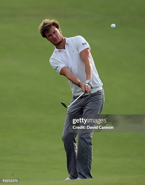 Chris Wood of England plays his second shot at the 12th hole during the second round of the Dubai World Championship, on the Earth Course, Jumeirah...