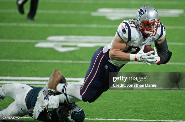 Rob Gronkowski of the New England Patriots is tackled by Rodney McLeod of the Philadelphia Eagles during Super Bowl Lll at U.S. Bank Stadium on...