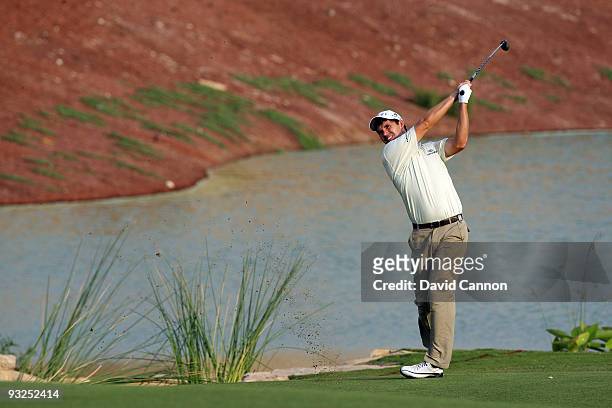 Padraig Harrington of Ireland plays his third shot on the 18th hole during the second round of the Dubai World Championship, on the Earth Course,...
