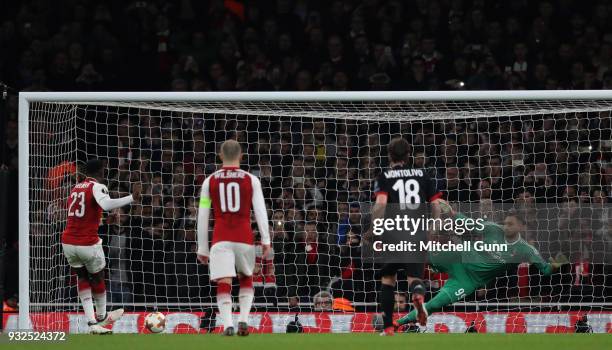 Danny Welbeck of Arsenal scores a goal from a penalty during the Europa League match between Arsenal and AC Milan at The Emirates Stadium on March...
