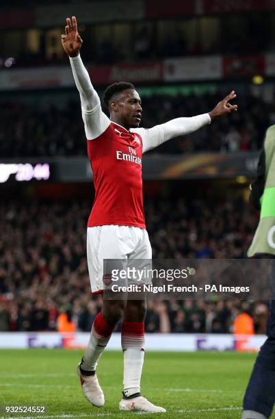 Arsenal's Danny Welbeck celebrates scoring his side's first goal of the game during the UEFA Europa League round of 16, second leg match at the...
