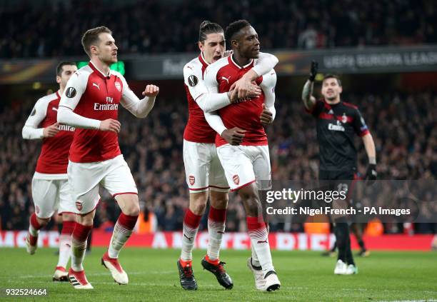 Arsenal's Danny Welbeck celebrates scoring his side's first goal of the game during the UEFA Europa League round of 16, second leg match at the...