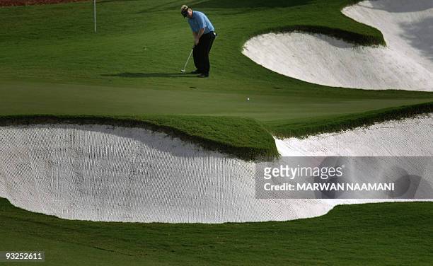 England's Ross McGowan plays a shot during the second round of the 7.5-million-dollar Dubai World Championship at the 7,675-yard Earth Course at...