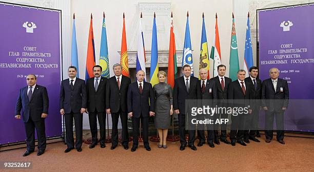 Russian Prime Minister Vladimir Putin poses for a group picture with his Ukrainian counterpart Yulia Tymoshenko and other leaders in Yalta on...