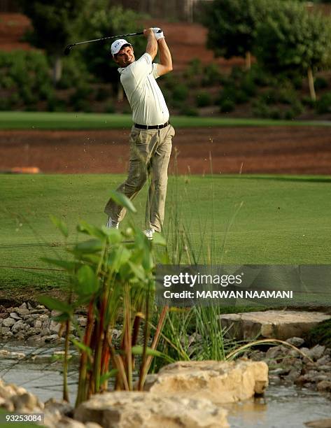 Ireland's Padraig Harrington plays a shot during the second round of the 7.5-million-dollar Dubai World Championship at the 7,675-yard Earth Course...