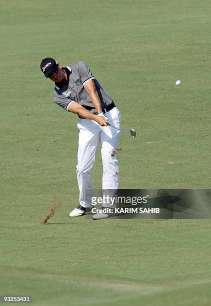 Sweden's Henrik Stenson plays a shot during the second round of the Dubai World Championship golf tournament at the Earth Course at Jumeirah Golf...