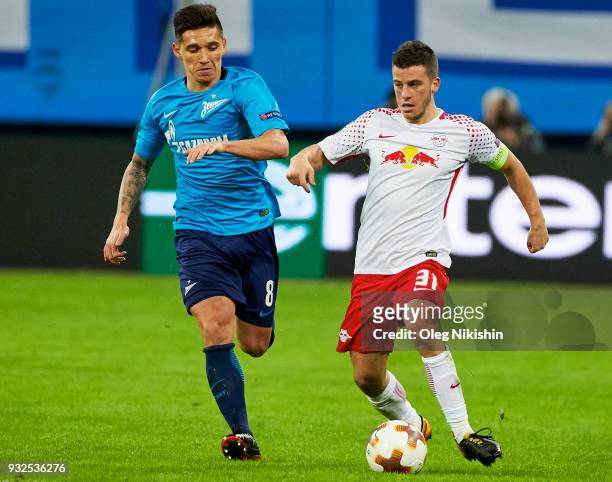 Matias Kranevitter of FC Zenit vies for the ball with Diego Demme of RB Leipzig during UEFA Europa League Round of 16 match between Zenit St...
