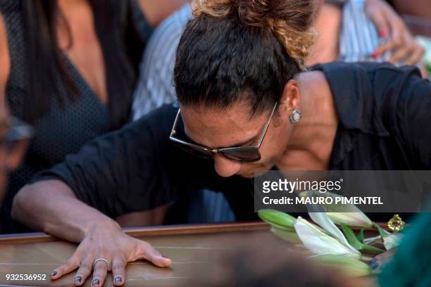 Relatives of Brazilian councilwoman and activist Marielle Franco pay tribute during her funeral at Caju Cemetery in Rio de Janeiro, Brazil on March...