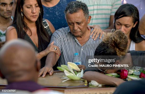 Relatives of Brazilian councilwoman and activist Marielle Franco pay tribute during her funeral at Caju Cemetery in Rio de Janeiro, Brazil on March...