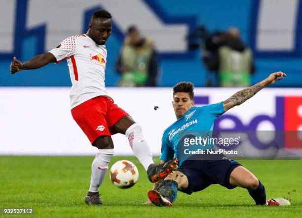 Emiliano Rigoni of FC Zenit Saint Petersburg and Naby Keita of RB Leipzig vie for the ball during the UEFA Europa League Round of 16 second leg match...