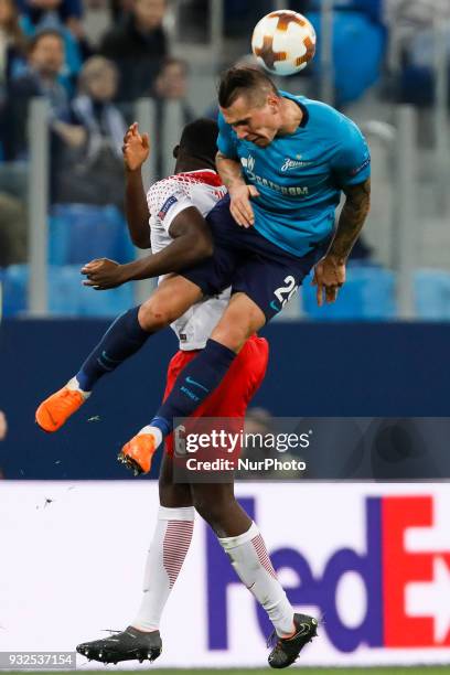 Anton Zabolotny of FC Zenit Saint Petersburg and Ibrahima Konate of RB Leipzig vie for the ball during the UEFA Europa League Round of 16 second leg...