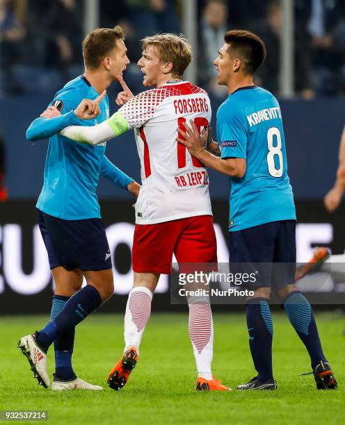 Domenico Criscito and Matias Kranevitter of FC Zenit Saint Petersburg argue with Emil Forsberg of RB Leipzig during the UEFA Europa League Round of...