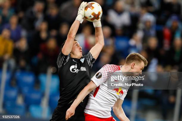 Andrei Lunev of FC Zenit Saint Petersburg vies for the ball with Lukas Klostermann of RB Leipzig during the UEFA Europa League Round of 16 second leg...