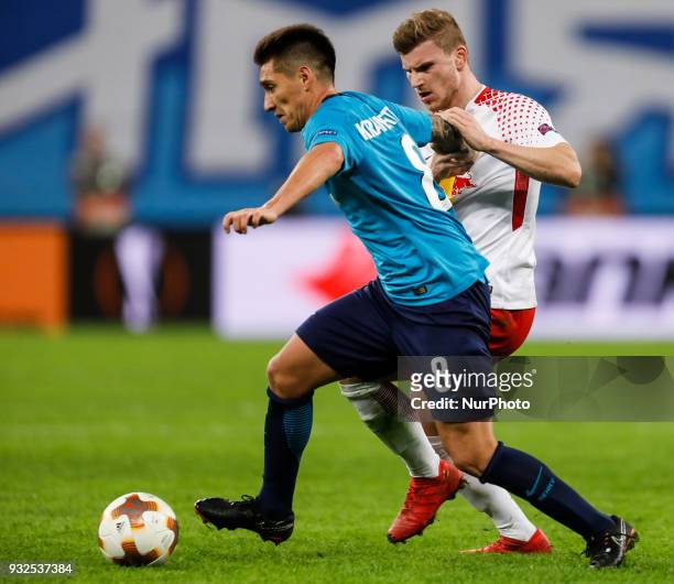 Matias Kranevitter of FC Zenit Saint Petersburg and Timo Werner of RB Leipzig vie for the ball during the UEFA Europa League Round of 16 second leg...