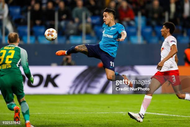 Sebastian Driussi of FC Zenit Saint Petersburg scores a goal as Peter Gulacsi and Bernardo of RB Leipzig defend during the UEFA Europa League Round...