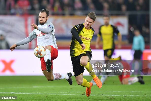 Andreas Ulmer of Salzburg and Lukasz Piszczek of Dortmund compete for the ball during the UEFA Europa League Round of 16, 2nd leg match between FC...