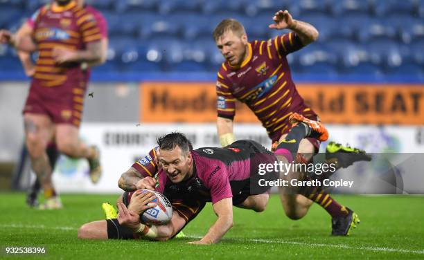 Danny McGuire of Hull KR celebrates with teammates after scoring a second half try during the Betfred Super League match between Huddersfield Giants...