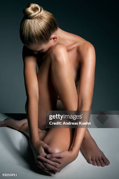 naked woman with shiny hair do sitting. - seated figure stock pictures, royalty-free photos & images