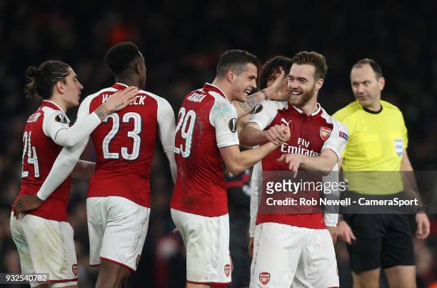 Arsenal's Granit Xhaka is congratulated after scoring his side's 2nd goal by Calum Chambers during the Europa League Round of 16 Second Leg match...