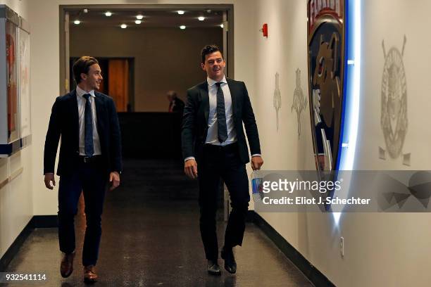Denis Malgin and teammate MacKenzie Weegar of the Florida Panthers arrive prior to the start of the game against the Boston Bruins at the BB&T Center...