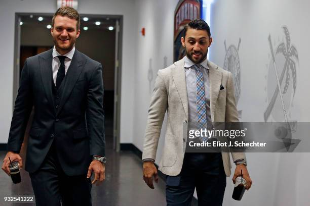 Jonathan Huberdeau and teammate Vincent Trocheck of the Florida Panthers arrive prior to the start of the game against the Boston Bruins at the BB&T...