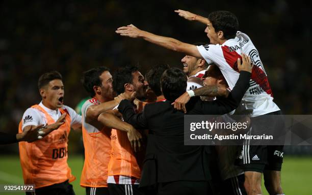 Gonzalo Martinez of River Plate celebrates with teammates after scoring the first goal of his team during the Supercopa Argentina 2018 between River...