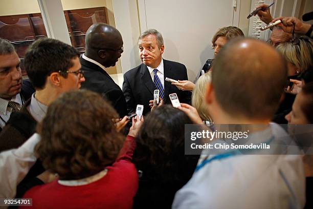 Senate Majority Whip Richard Durbin is surrounded by reporters after holding a news conference on health care at the U.S. Capitol November 20, 2009...