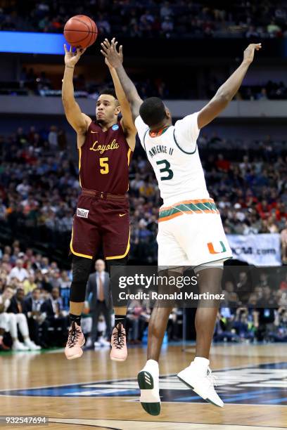 Marques Townes of the Loyola Ramblers shoots over Anthony Lawrence II of the Miami Hurricanes inthe second half in the first round of the 2018 NCAA...