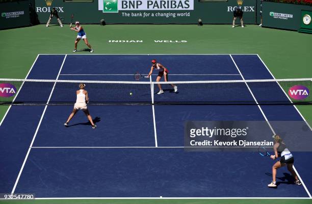 Russian doubles partners Ekaterina Makarova and Elena Vesnina of Russia take on Timea Babos of Hungary and Kristina Mladenovic of France during Day 9...