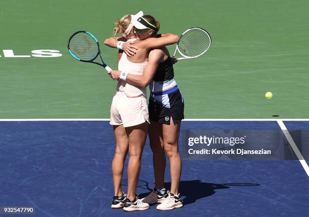 Russian doubles partner Ekaterina Makarova and Elena Vesnina of Russia celebrate after defeating Timea Babos of Hungary and Kristina Mladenovic of...