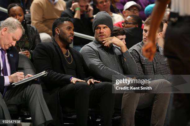 Jason Derulo and Greg Olsen attend the game between the Brooklyn Nets and the Charlotte Hornets on March 8, 2018 at Spectrum Center in Charlotte,...