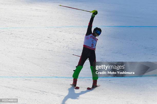 Valerii Redkozubov of the Neutral Paralympic Athlete reacts after competing in the Alpine Skiing Men's Super Combined - Visually Impaired on day four...