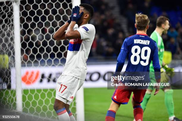 Lyon's French defender Myziane Maolida reacts during the UEFA Europa League round of 16 football match between Lyon and Moscow at the Groupama...