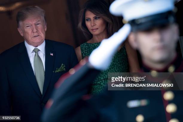 President Donald Trump and US first lady Melania Trump arrive to greet Ireland's Prime Minister Leo Varadkar outside the White House March 15, 2018...