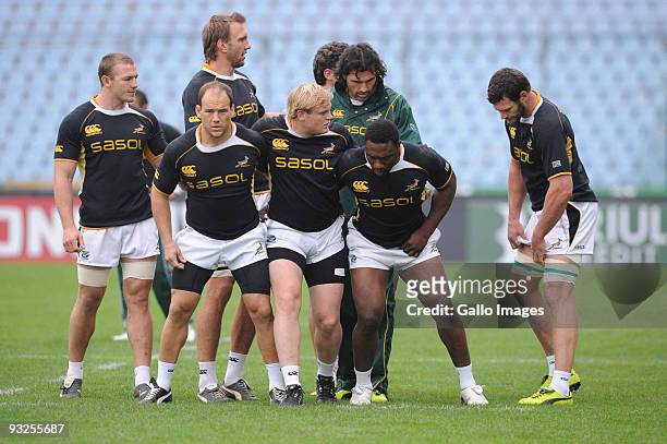 Botha, Adriaan Strauss and Tendai Mtawarira of South Africa scrum down during the Springboks captains run session held on November 20, 2009 at the...