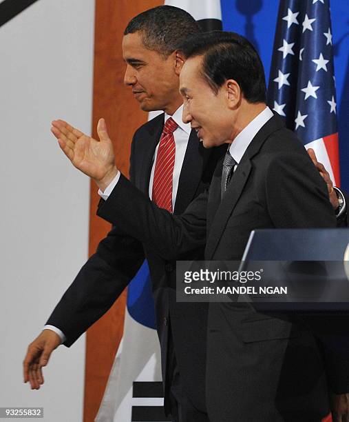 President Barack Obama and South Korean President Lee Myung-bak make their way from the stage following a joint press conference at the presidential...