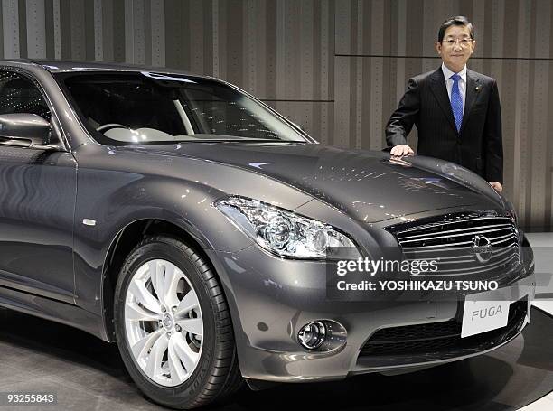 Of Japanese auto giant Nissan Motor, Toshiyuki Shiga, introduces the company's new luxury sedan "Fuga", equipped with 2.5 or 3.7-litre V6 engines, at...