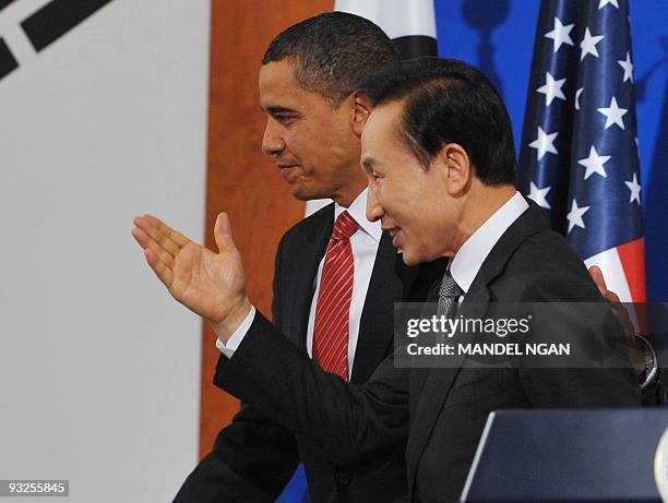 President Barack Obama and South Korean President Lee Myung-bak make their way from the stage following a joint press conference at the presidential...