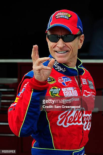 Mark Martin, driver of the Kellogg's/CARQUEST Chevrolet, walks in the garage area prior to practice for the NASCAR Sprint Cup Series Ford 400 at...