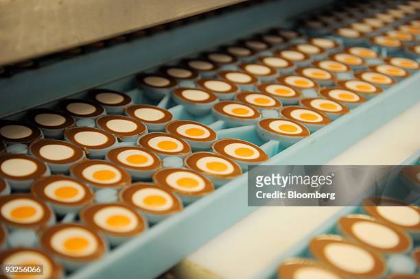 Cadbury's Creme Egg moulds move down the production line at the Cadbury Plc factory in Birmingham, U.K., on Friday, Nov. 20, 2009. Cadbury Plc should...
