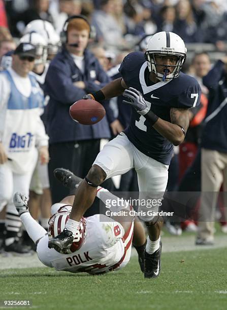 Curtis Drake of the Penn State Nittany Lions rushes the ball past Nick Polk of the Indiana Hoosiers at Beaver Stadium on November 14, 2009 in State...