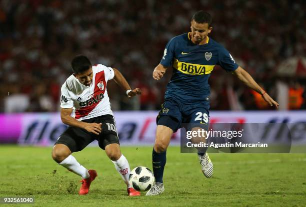 Leonardo Jara of Boca Juniors fights for the ball with Gonzalo Martinez of River Plate during the Supercopa Argentina 2018 between River Plate and...