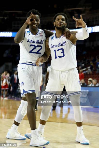 Myles Cale and Myles Powell of the Seton Hall Pirates celebrate after beating the North Carolina State Wolfpack 94-83 during the first round of the...