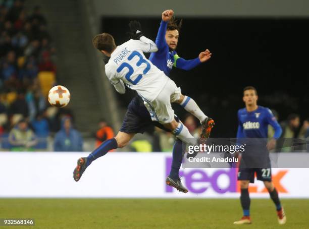 Marco Parolo of Lazio in action against Josip Pivaric of Dynamo Kyiv during the Europa League round 16 second second leg football match between FC...